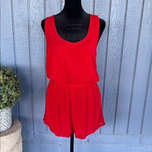 Ambiance Apparel short romper in an orange-red color and medium
